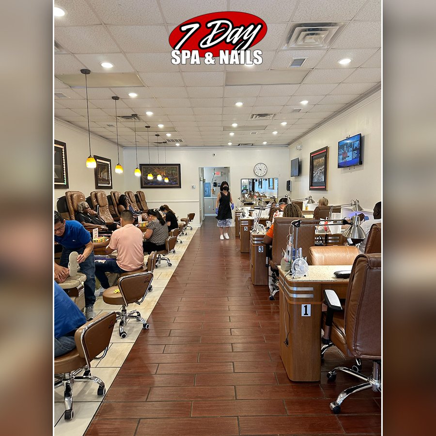 Clean nail salon interior with seating.