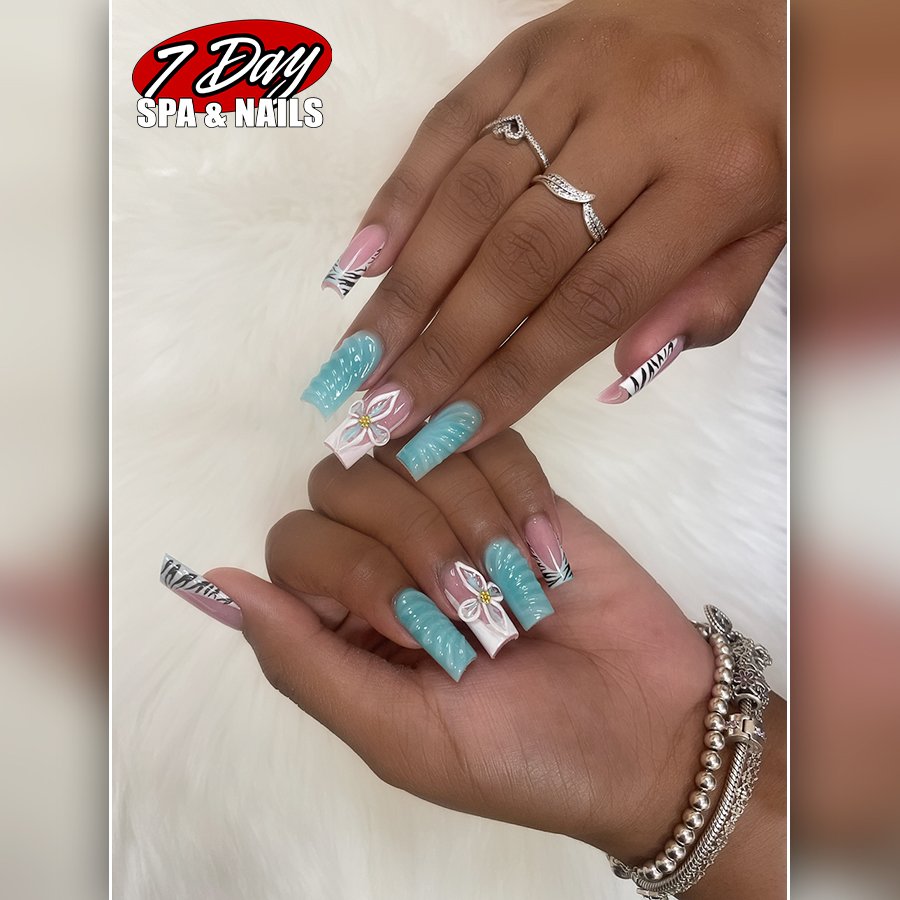 Nail care setup with bottles and towels.